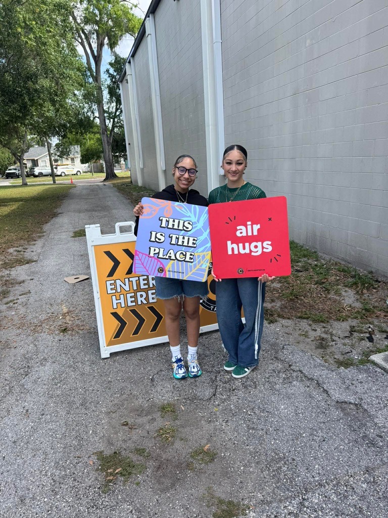 Two Christ Fellowship welcome team members ready to greet and help Sunday guests